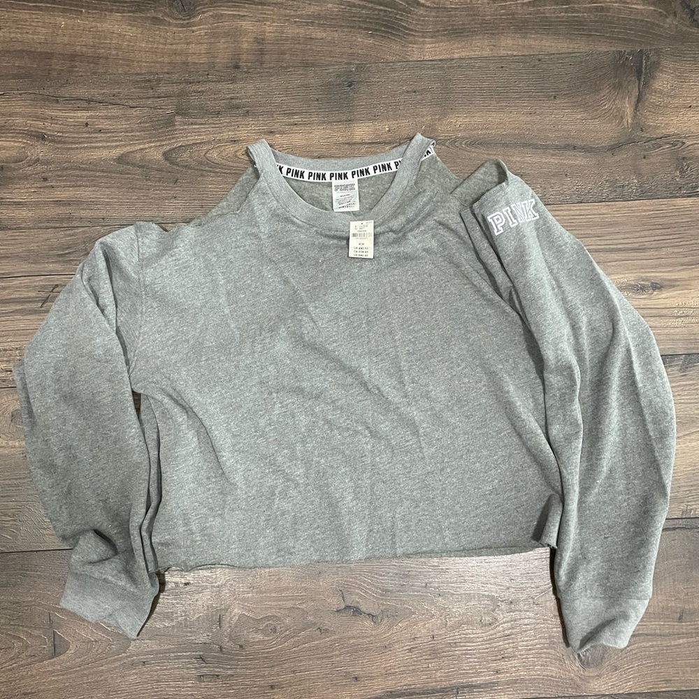 PINK, gray sweater with shoulder cutouts, somewhat cropped, size medium.